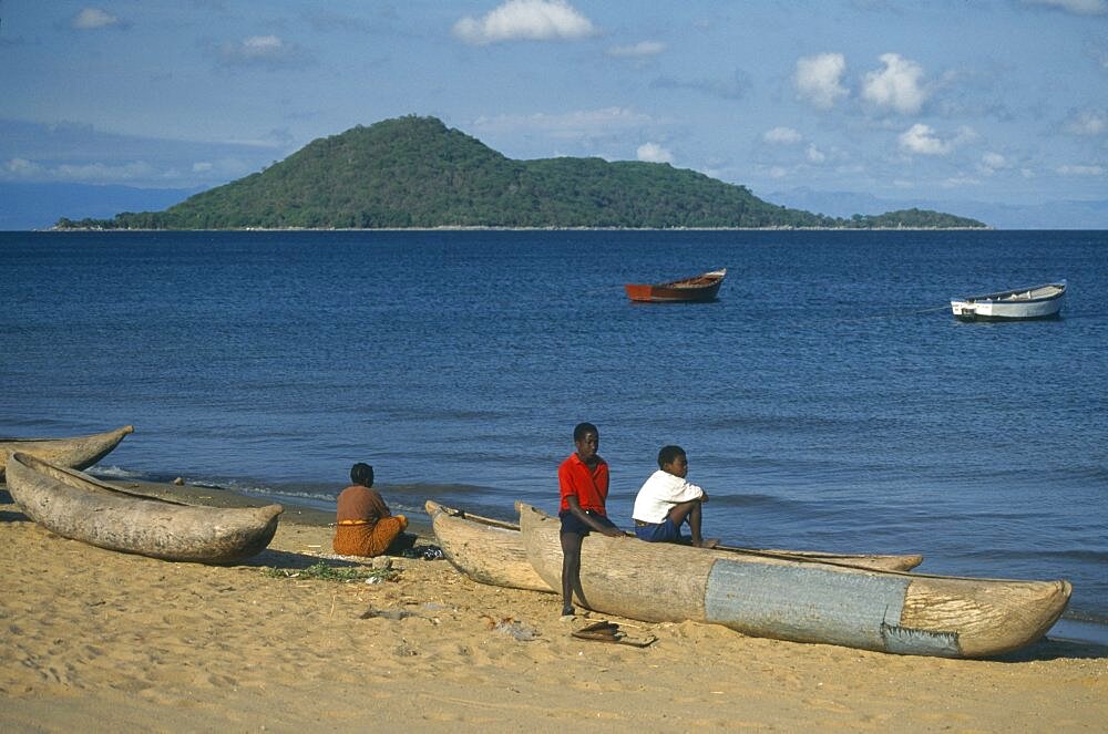 MALAWI  Lake Malawi Cape Maclear.  Boys with fishing boats.