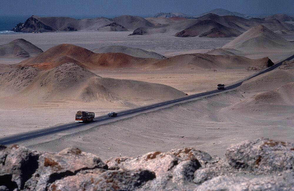 PERU  Landscape Car and buses on the Pan American highway through coastal desert area  Automobile