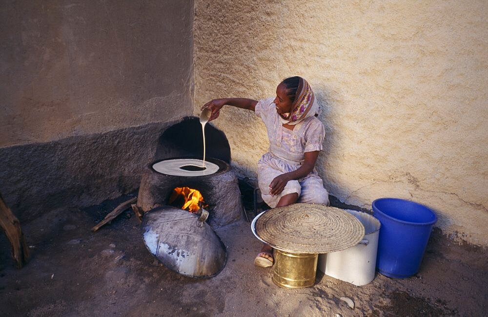 ERITREA  Keren Woman cooking injera  a type of sour  flat bread that accompanies most meals.