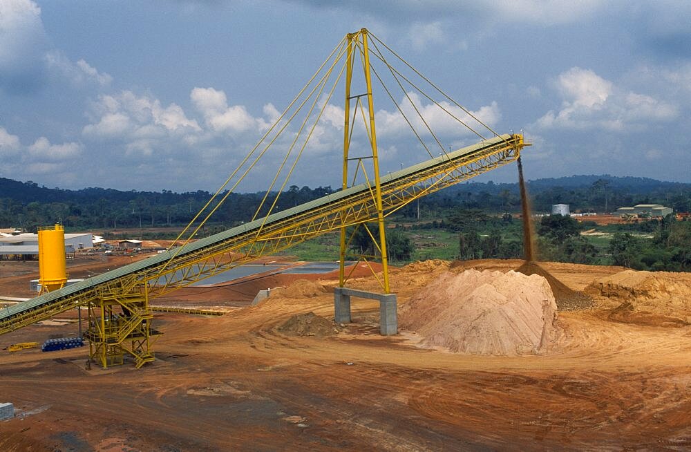 GHANA  Industry Gold mine with conveyer belt extracting waste material.