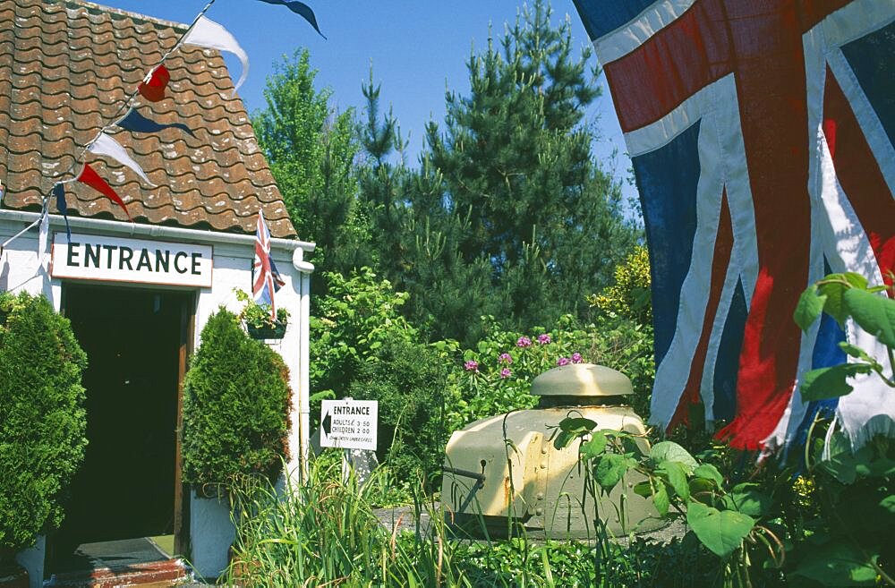 UNITED KINGDOM Channel Islands Guernsey Forest Parish. German Occupation Museum. Main entrance with Union Jack flag flying in forground.