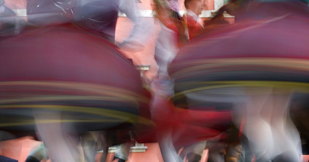 POLAND Warsaw Detail of traditional dancers costumes performing in the Old Town. Moving blurred skirts. Eastern Europe Holidays Travel Tourism Colour National Dress Movement Color