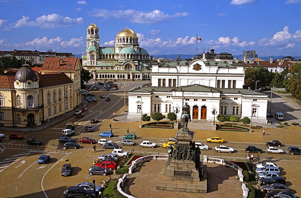 BULGARIA  Sofia Liberation Monument  Bulgarian Parliament Building  Science Academy  and Alexander Nevsky Cathedral. Travel Tourism Holiday Vacation Explore Recreation Leisure Sightseeing Tourist Attraction Tour Building Architecture Architectural Sofia Capital City Bulgaria Bulgarian East Eastern Europe European Calendar Vivid Vibrant Summer Bright Sunny Sun Blue Sky Liberation Monument Parliament Government History Historic Historical Magnificent National Assembly Cars Traffic Building Architecture Architectural Alexander Nevsky Nevski Cathedral Church Churches Religion Religious Christianity Orthodox Holy Divine Christian Theology Pray Prayer Worship Worshipping Worshiping Calendar Vivid Vibrant Fluffy Cloud Centre Center Landscape Panorama Panoramic Science Academy University Eastern Europe