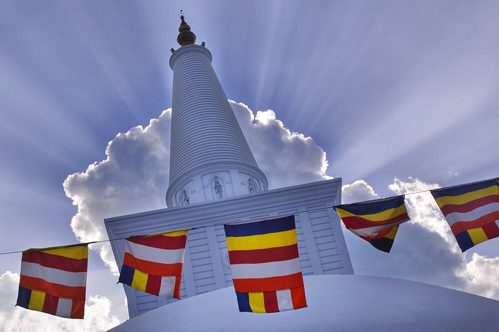 SRI LANKA  Anuradhapura Prayer flags hanging in front of Ruvanvelisaya Dagoba.  worship prayer Buddhism Buddha Asia Sri Lanka travel shrine faith Asian Llankai Sri Lankan