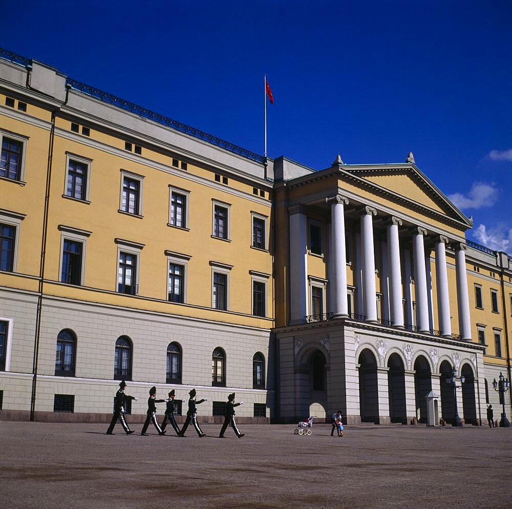 Royal Palace frontage with five guardsmen marching and sentry box, Oslo, Akershus, Norway