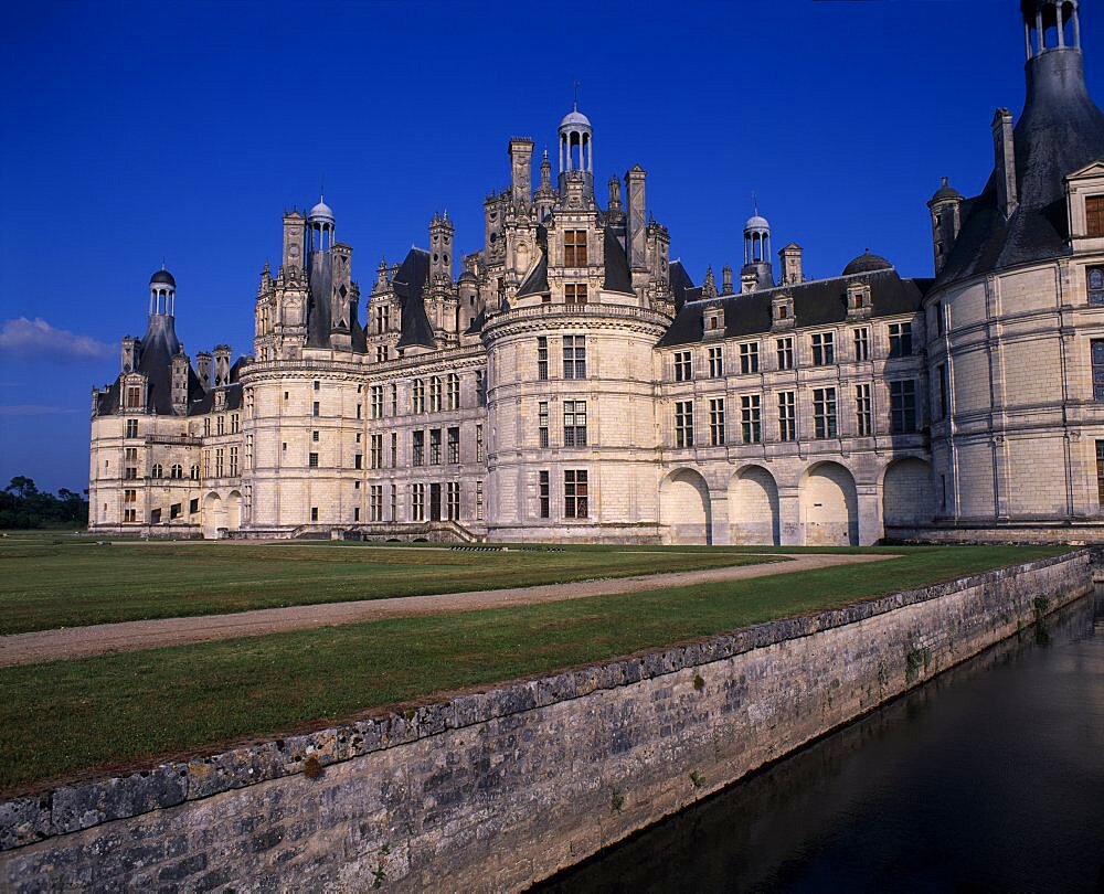 Chambord Palace seen from across water and formal gardens, Loir et Cher, Loire Valley, France