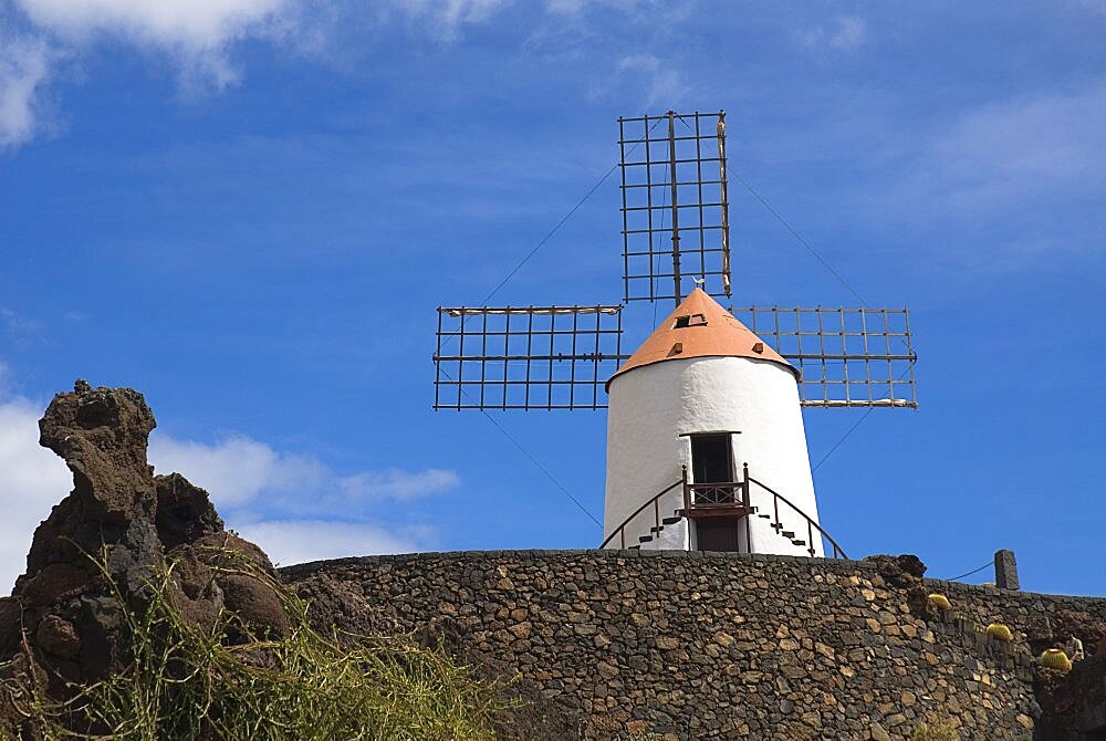 Jardin de Cactus, Restored windmill in garden in former volcanic quarry designed by Cesar Manrique, Lanzarote, Canary Islands, Spain