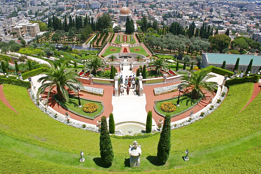 Zionism Avenue, View of Bahai Shrine and Gardens built as memorial to founders of the Bah ai faith, Formal layout of flowerbeds and pathways with cypress trees central domed shrine and city beyond, Haifa, Israel