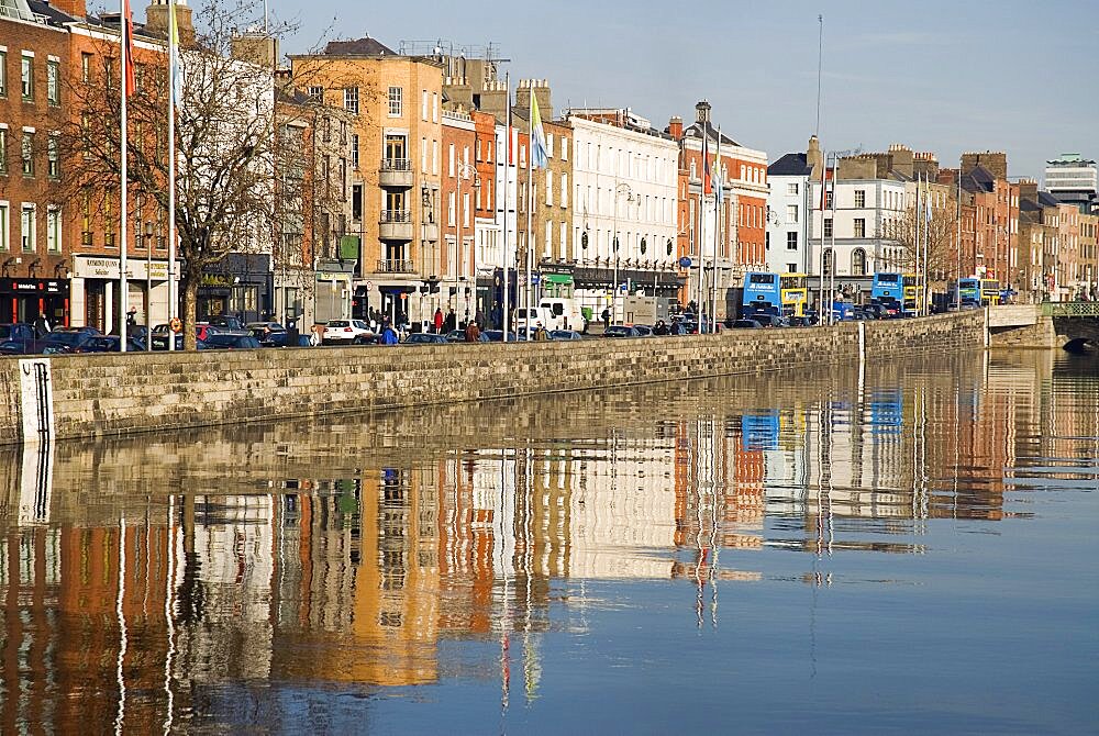 Quayside buildings reflected in the River Liffey near Capel Street Bridge, Ireland, Eire