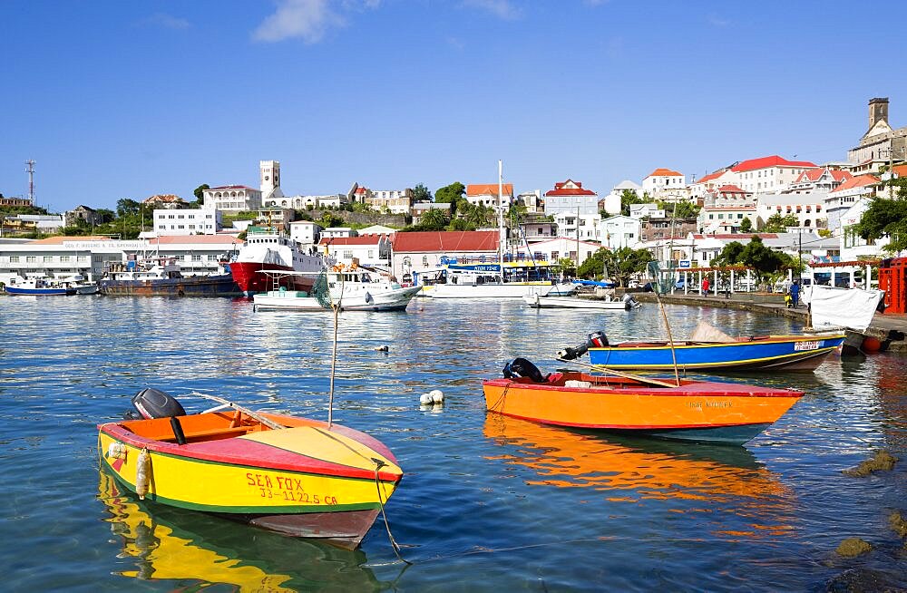 Water taxi boats moored in the Carenage harbour of the capital city of St. Georges, Grenada, West Indies, Caribbean, Central America