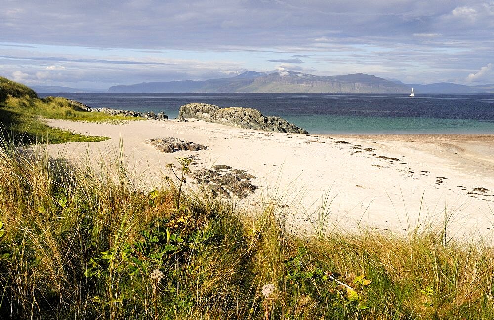 Grasses and sandy beach with views of Mull, United Kingdom