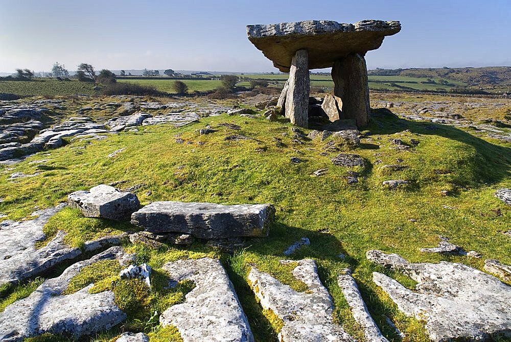 Ireland, County Clare, The Burren, Poulnabrone Dolmen - The thin capstone sits on two 18 metre (6 feet) high portal stones.