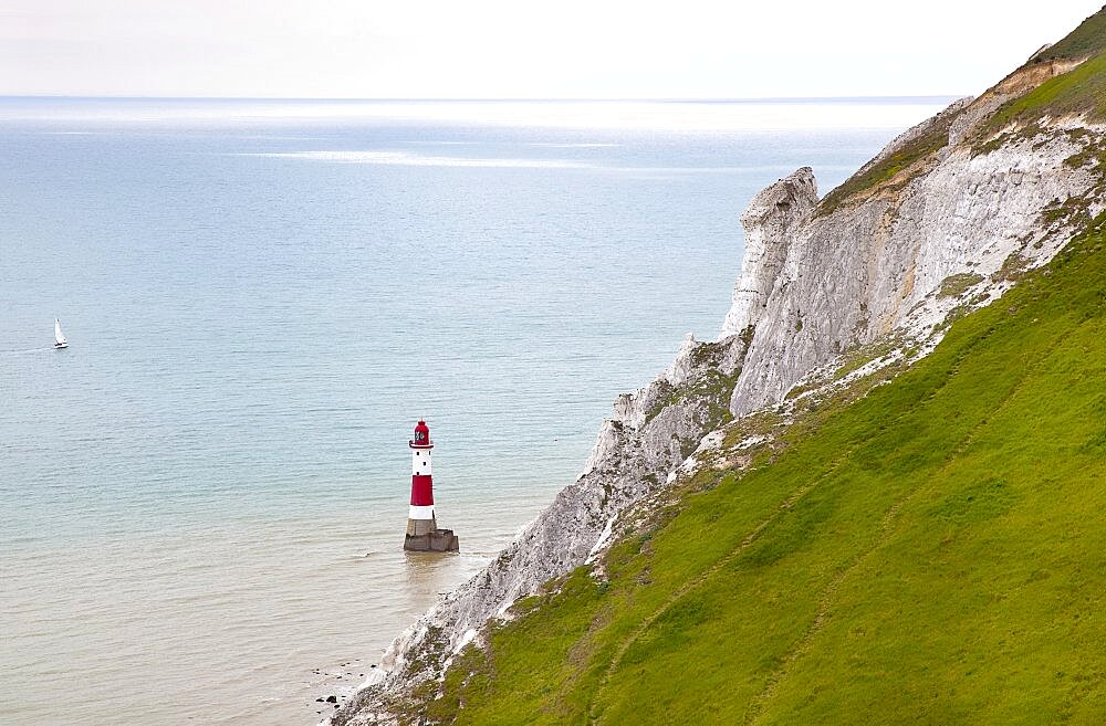 England, East Sussex, Eastbourne, Beachy Head, view of the lighthouse at the base of the chalk cliffs