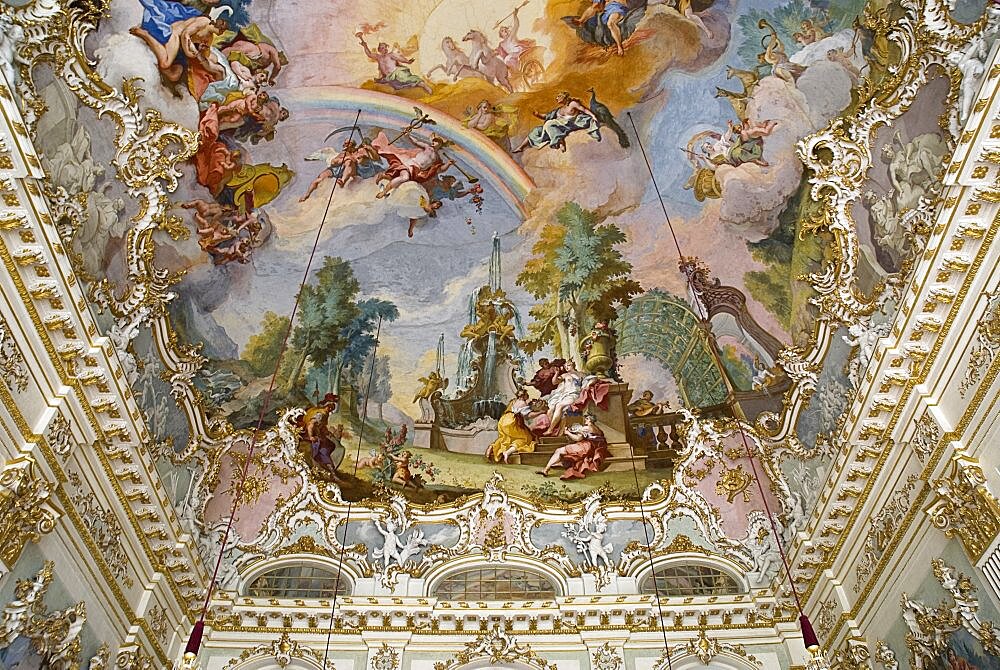 Germany, Bavaria, Munich, Nymphenburg Palace. Interior of Steinerner Saal the Stone or Great Hall with white and gold baroque decoration and painted ceiling by Johann Baptist Zimmermann.