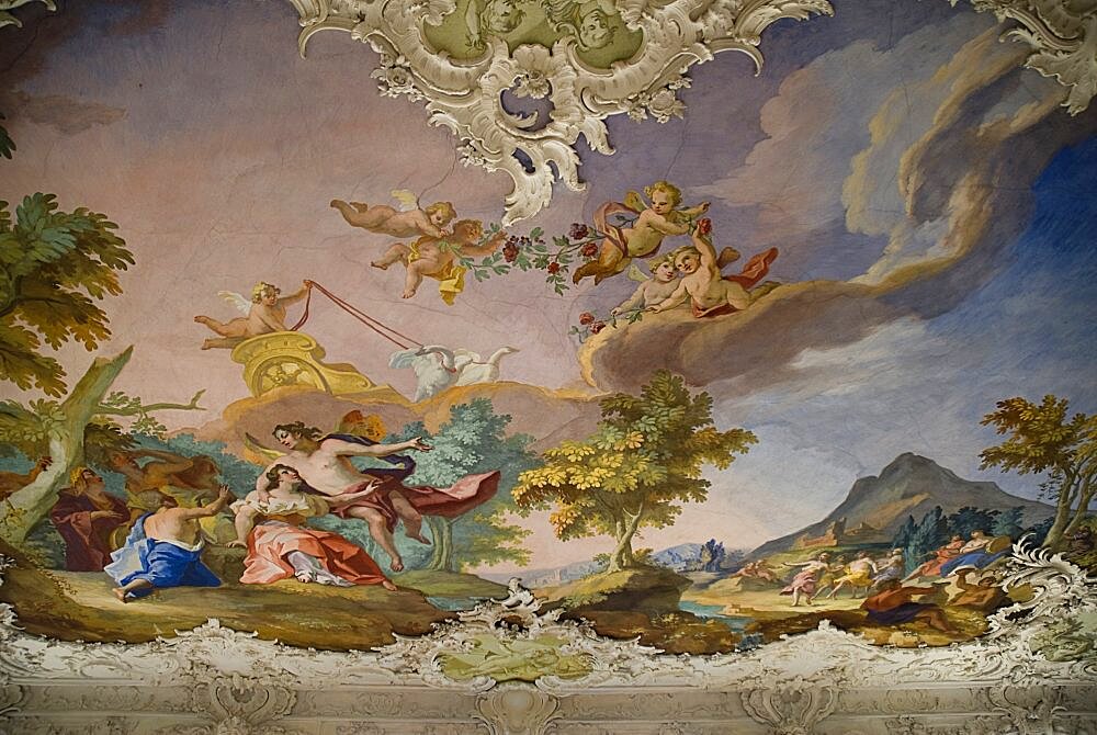 Germany, Bavaria, Munich, Nymphenburg Palace. Interior of Steinerner Saal the Stone or Great Hall with white and gold baroque decoration and painted ceiling by Johann Baptist Zimmermann.