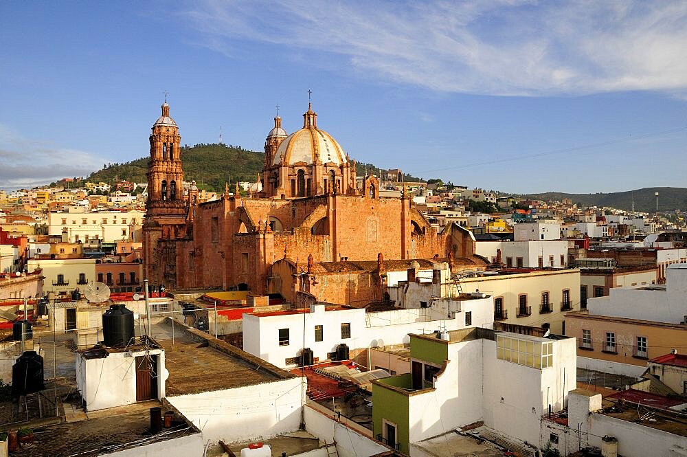 View across flat rooftops of houses towards Cathedral, Zacatecas, Bajio, Mexico