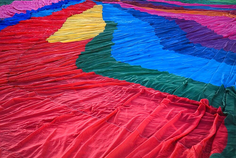 Annual balloon fiesta Detail of colourful hot air balloon spread over ground before inflating, Albuquerque, New Mexico, United States of America