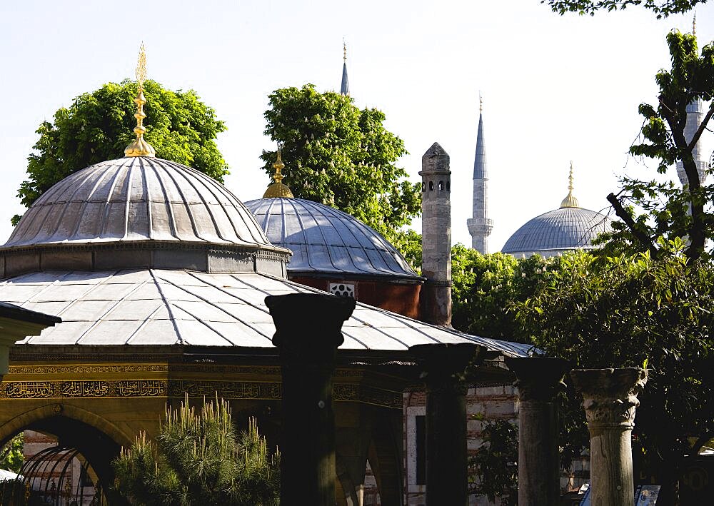 Sultanahmet Haghia Sophia Ablutions Fountain with dome and minarets of the Blue Mosque beyond, Istanbul, Turkey