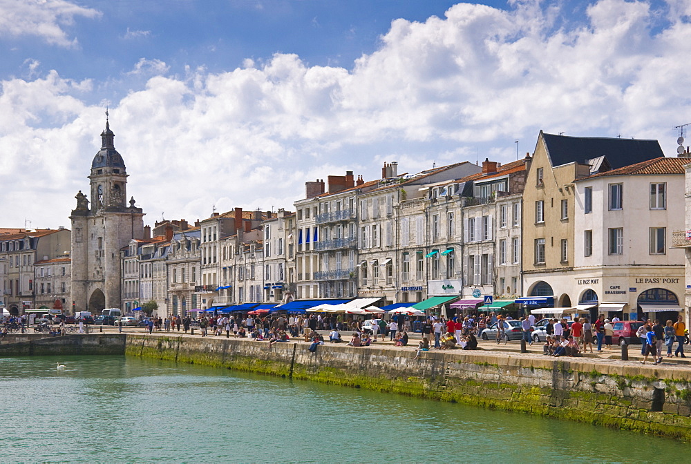 Restaurants lining the edge of the marina in the ancient port of La Rochelle, Charente-Maritime, France, Europe