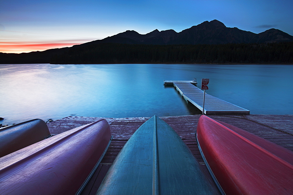 Canoes pulled up on the jetty at Patricia Lake, Jasper National Park, UNESCO World Heritage Site, Alberta, Rocky Mountains, Canada, North America