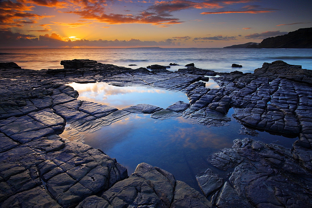 Rockpools on Broad Bench looking towards Gad Cliff and the Isle of Portland, Hobarrow Bay, Jurassic Coast, UNESCO World Heritage Site, Dorset, England, United Kingdom, Europe