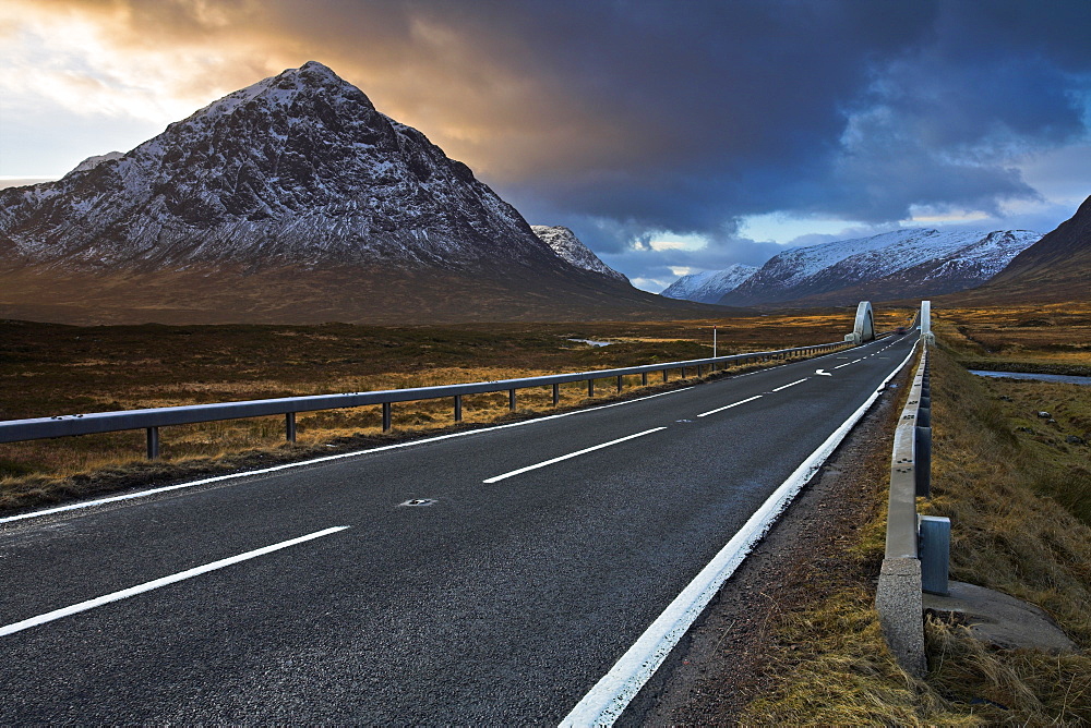 The A82 passing Buachaille Etive Mor as it winds through Rannoch Moor towards Glen Coe, Highland, Scotland, United Kingdom, Europe