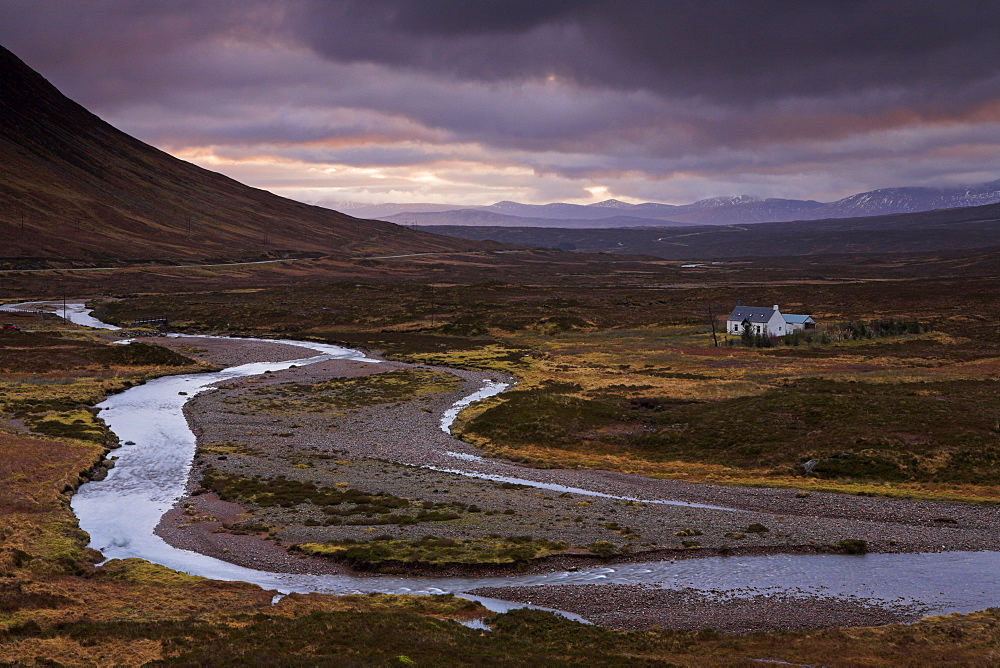 A small bothy adds a sense of scale to the wide open expanse of Rannoch Moor, Highlands, Scotland, United Kingdom, Europe