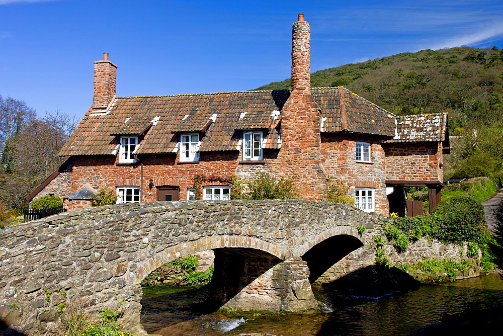 Packhorse bridge and cottage in the village of Allerford, Exmoor National Park, Somerset, England, United Kingdom, Europe