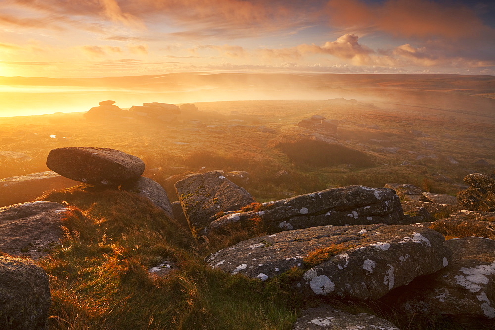 Sunrise over a misty moor viewed from Littaford Tor, Dartmoor, Devon, England, United Kingdom, Europe