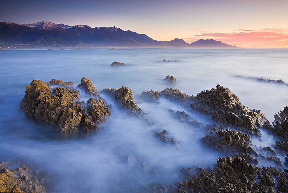 Dawn over the Seaward Kaikoura Mountain range from Kaikoura Peninsula, South Island, New Zealand, Pacific