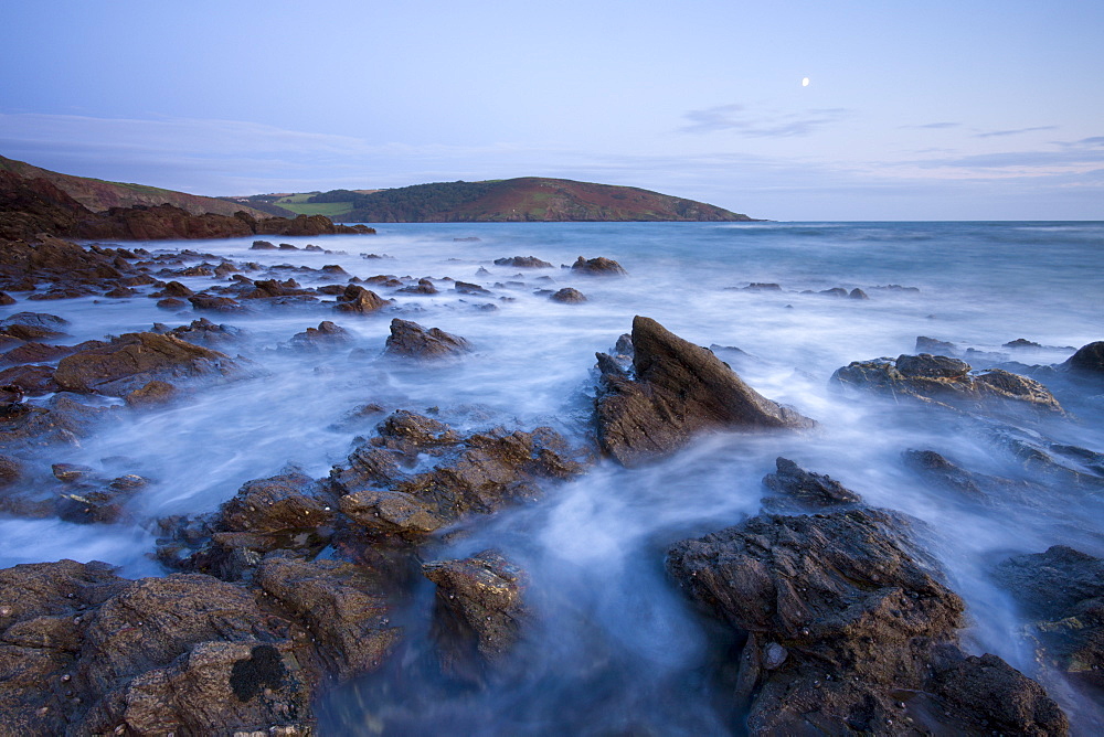 Incoming tide swirls around the rocky shores of Wembury Bay in South Devon, England, United Kingdom, Europe