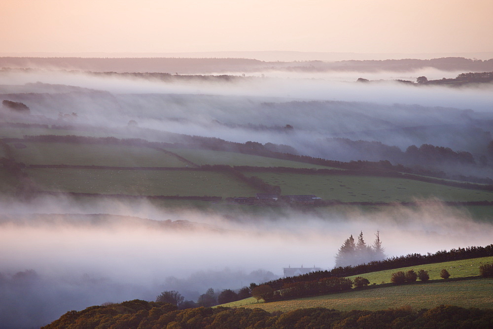 Early morning mist over the Exmoor countryside, viewed from Dunkery Hil, Exmoor National Park, Somerset, England, United Kingdom, Europe