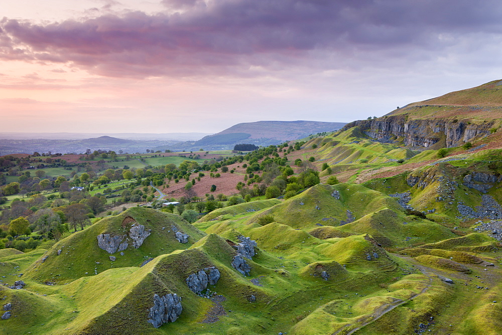 Sunrise over the abandoned quarry workings on the Llangattock Escarpment, Brecon Beacons National Park, Powys, Wales, United Kingdom, Europe