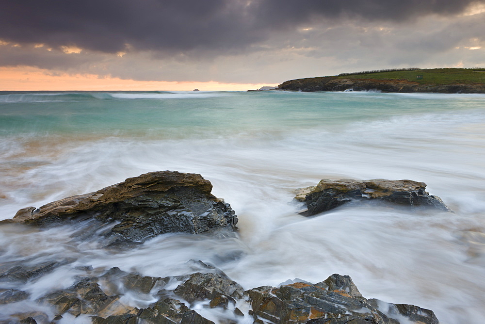 Incoming waves surge onto the shore at Harlyn Bay in North Cornwall, England, United Kingdom, Europe