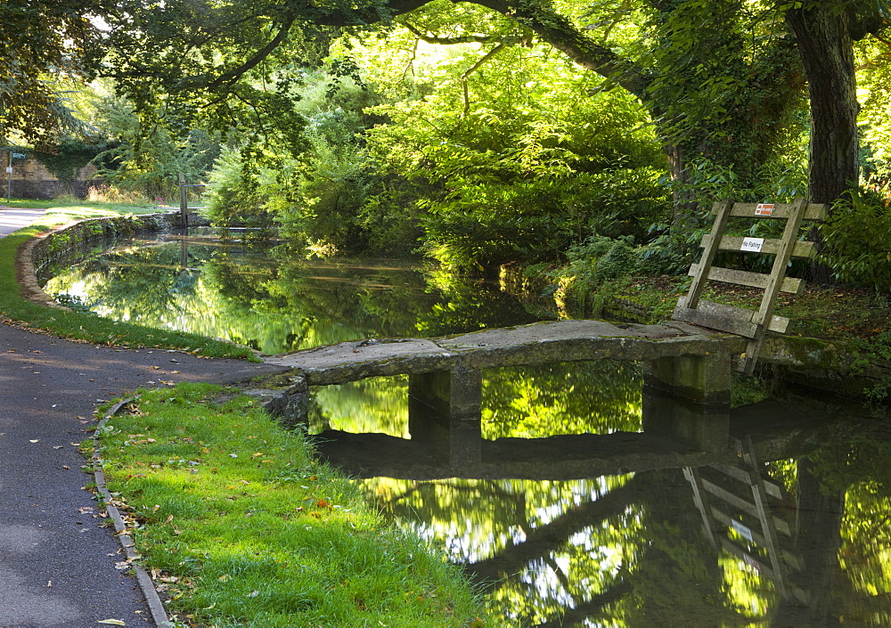 Stone footbridge over the River Eye in the Cotswolds village of Lower Slaughter, Gloucestershire, The Cotswolds, England, United Kingdom, Europe