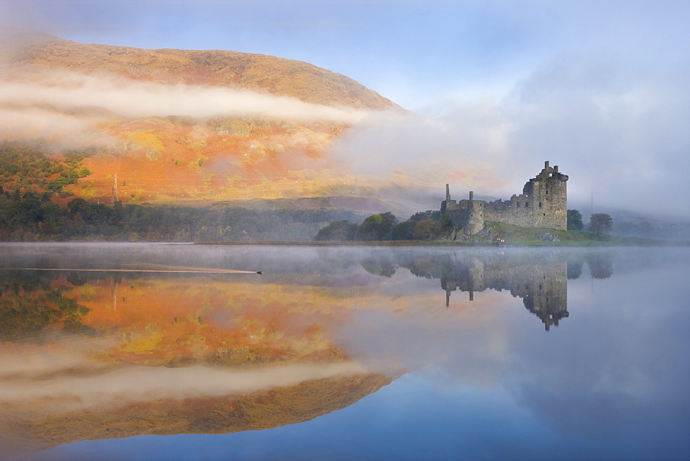 A misty autumn morning beside Loch Awe with views to Kilchurn Castle, Argyll and Bute, Scotland, United Kingdom, Europe