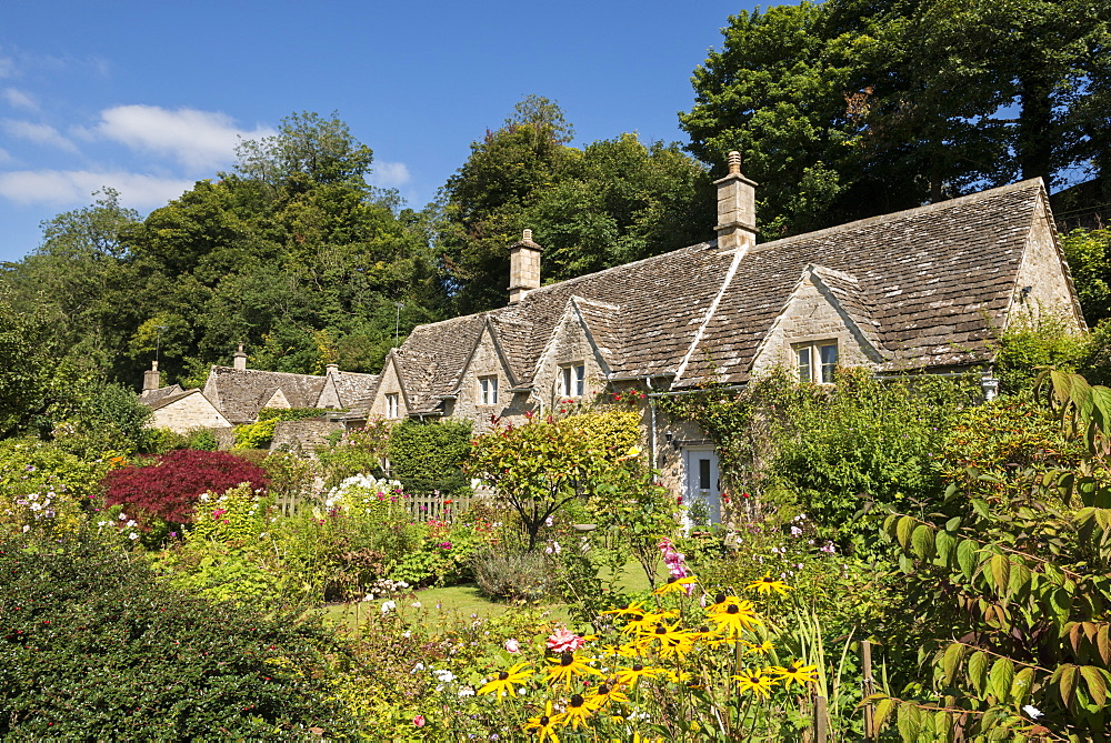 Pretty country cottages and gardens in the picturesque Cotswolds village of Bibury, Gloucestershire, England, United Kingdom, Europe