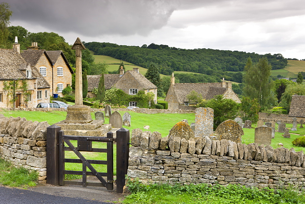 Graveyard and cottages in the pretty Cotswolds village of Snowshill, Worcestershire, England, United Kingdom, Europe 