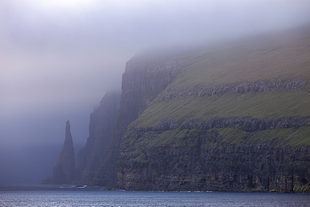 Towering cliffs and sea stacks on the west coast of Sandoy, Faroe Islands, Denmark, Europe 