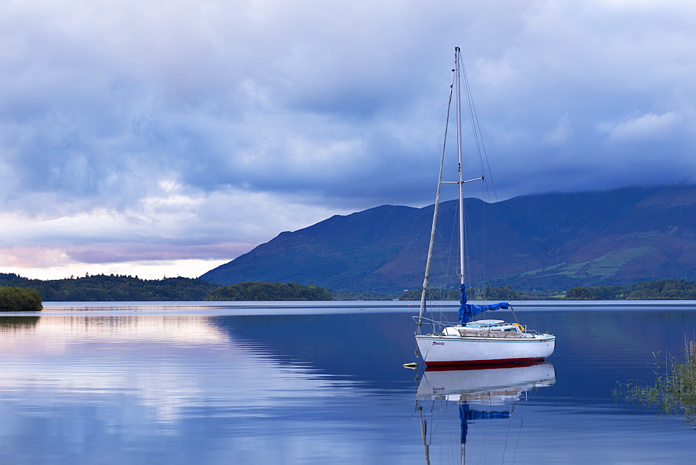 Yacht anchored on Derwent Water at twilight, Lake District National Park, Cumbria, England, United Kingdom, Europe