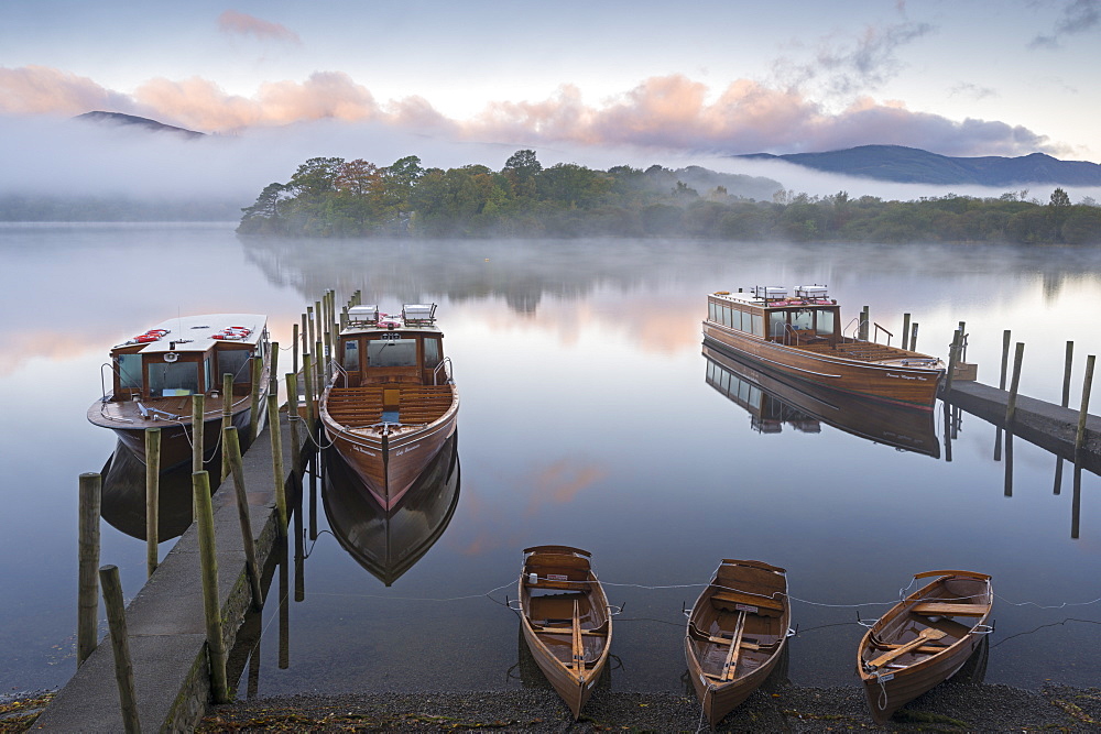 Boats on Derwent Water on a misty autumn morning, Lake District National Park, Keswick, Cumbria, England, United Kingdom, Europe