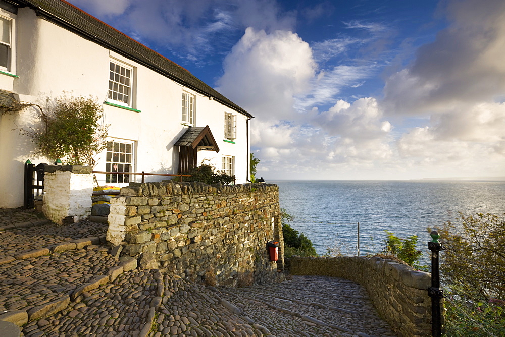 Whitewashed cottage and cobbled lane in the picturesque village of Clovelly, Devon, England, United Kingdom, Europe 