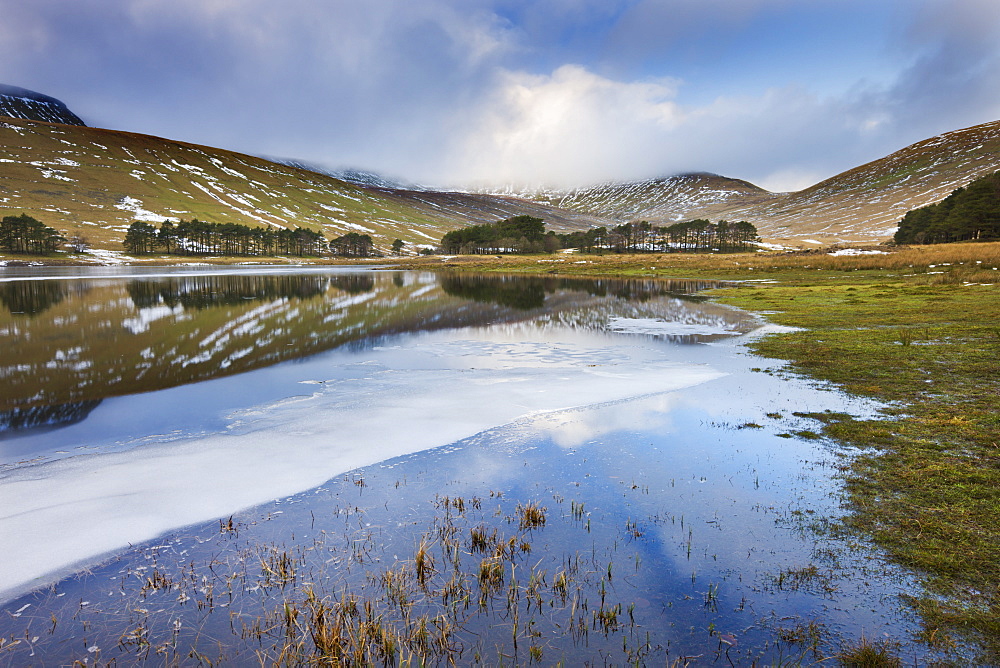 Ice and reflections of Pen y Fan in the Upper Neuadd Reservoir, Brecon Beacons National Park, Powys, Wales, United Kingdom, Europe 