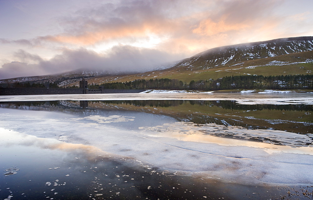 Broken ice floating on the Upper Neuadd Reservoir with Graig Fan Ddu in the background, Brecon Beacons National Park, Powys, Wales, United Kingdom, Europe 