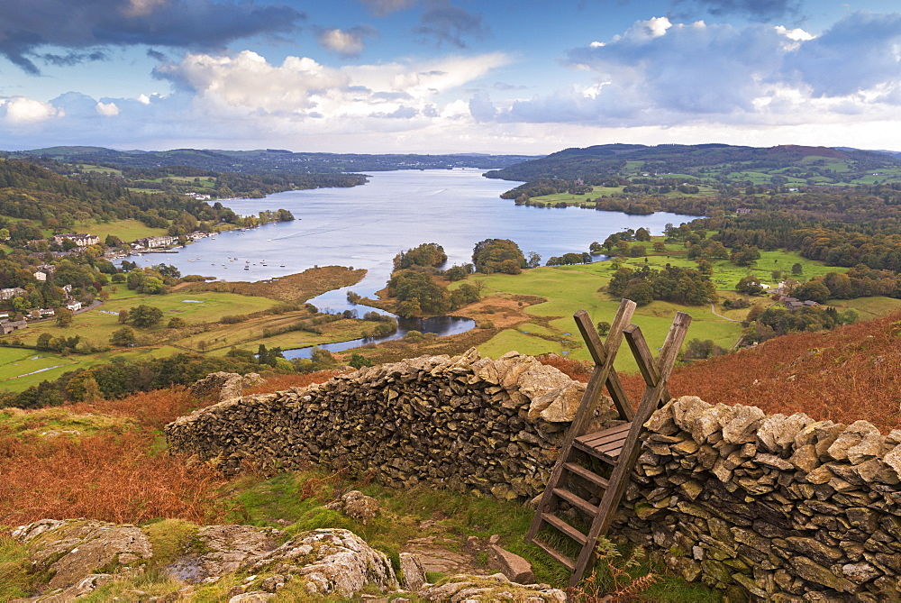 Drystone wall and stile with views to Windermere in autumn, Lake District National Park, Cumbria, England, United Kingdom, Europe 