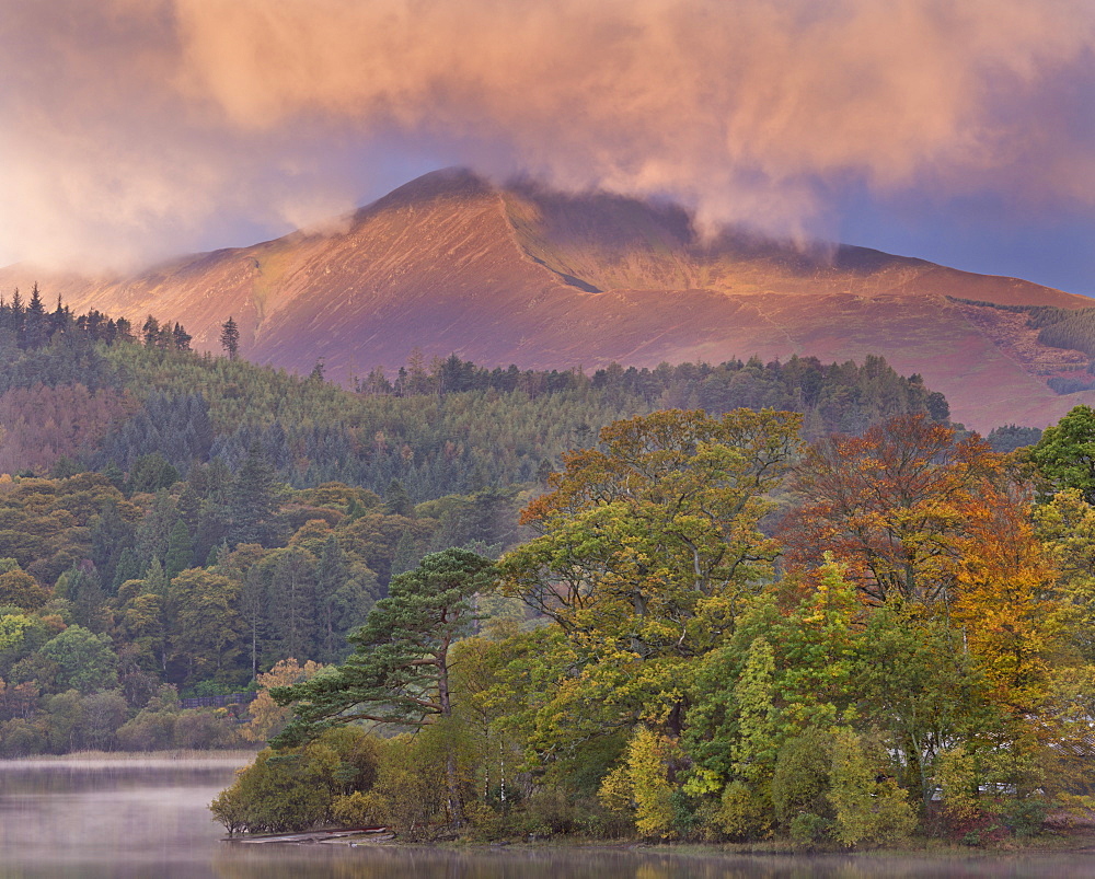 Autumnal foliage on Derwent Water, with mountains beyond. Lake District National Park, Cumbria, England, United Kingdom, Europe 