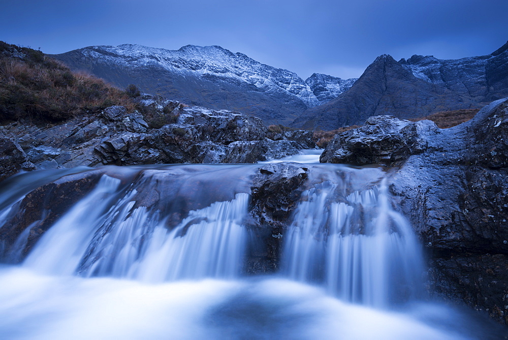 Fairy Pools waterfalls at Glen Brittle, with the snow dusted Cuillin mountains beyond, Isle of Skye, Inner Hebrides, Scotland, United Kingdom, Europe 