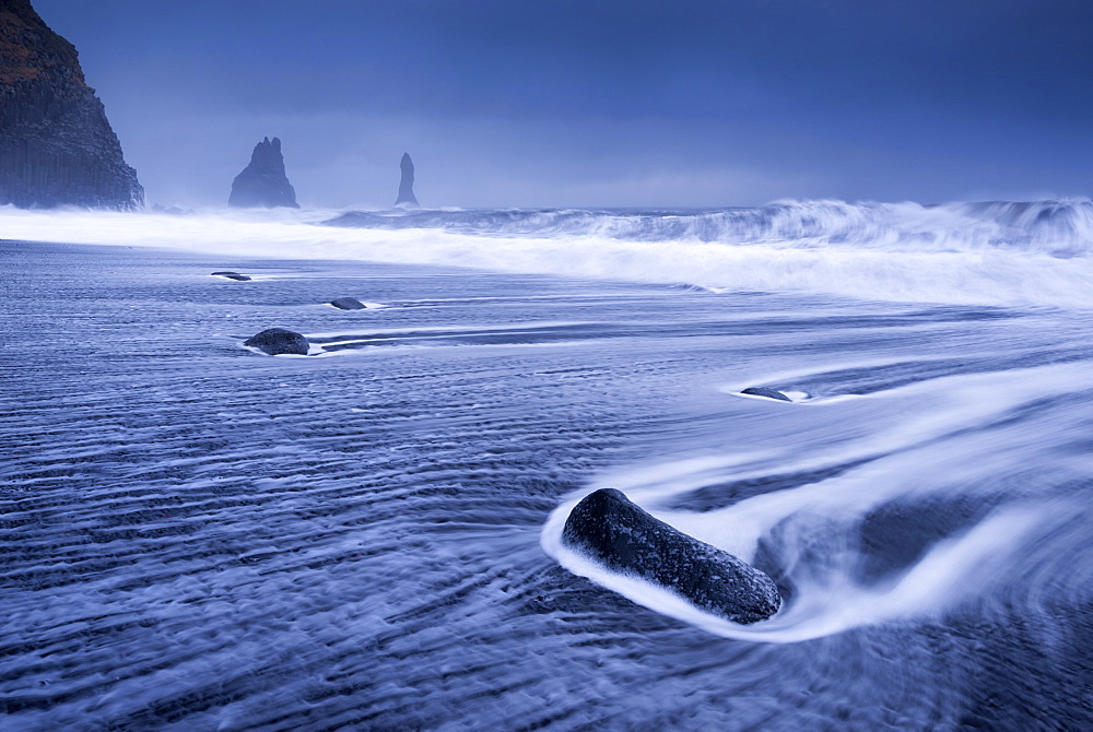 Waves rushing over black sand beach near Vik on the South coast of Iceland, Polar Regions 