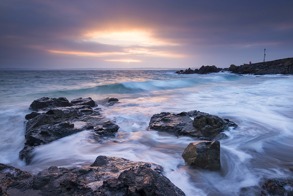 Winter sunrise at Porthgwidden Beach in St. Ives, Cornwall, England, United Kingdom, Europe 