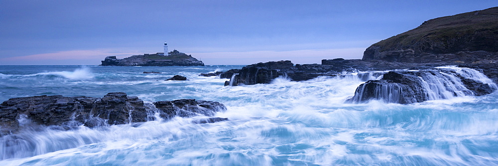 Waves crash around the rocks in winter near Godrevy Lighthouse, Cornwall, England, United Kingdom, Europe 